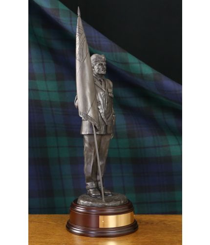 This is our 12" scale Scottish Standard Bearer with Glengarry. We can add your regimental cap badge to the base by his feet. We offer a choice of wooden bases and free engraving. 
