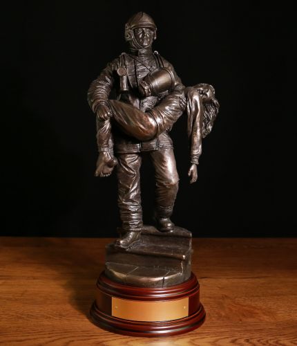 British Fire and Rescue Service, Modern Saved Firefighter sculpture depicting a British Firefighter rescuing a young girl from a burning house or flat. We Include an engraved brass plate if required
