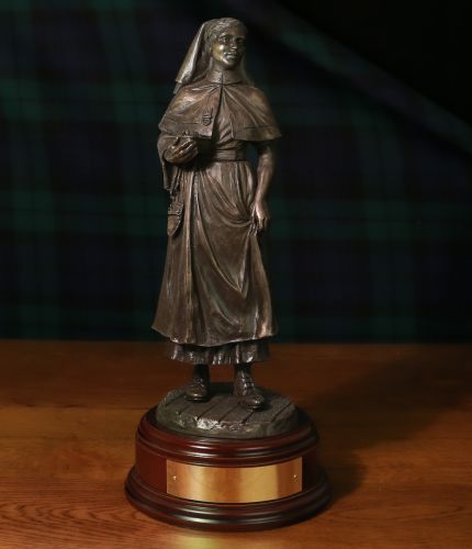 A British war-time front line nurse sculpture. The cold cast bronze statuette makes an excellent retirement gift for anyone in the NHS or other Nursing Service. There's a choice of wooden base and engraved brass plate included