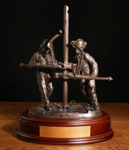 Bronze Sculpture depicting two Riggers or 'Roustabouts' involved in oil & gas exploration. This presentation piece makes an excellent long service, safety or retirement gift. The Wooden base and engraved plate are included.