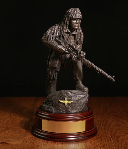 This is an 11" scale cold cast bronze resin sculpture of a Parachute Regiment Sniper with the L96 Sniper Rifle. The sculpture makes a perfect retirement gift and we include this standard wooden base and an engraved brass plate as standard.