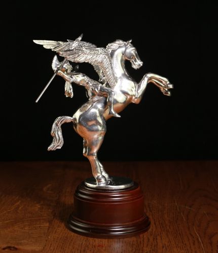 This pure pewter, polished sculpture is of Pegasus and Bellerophon, the symbol of the British Airborne Forces. We offer the ornament with a choice of wooden bases and a free engraved nickel silver plate.