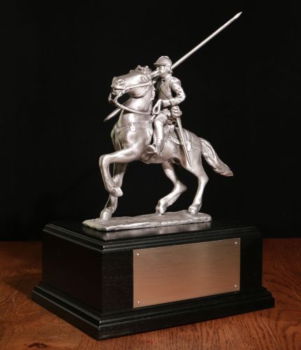 This is the buffed pewter sculpture of the Galashiels War Memorial. It stands 10" tall from the horse's hoof to the tip of the lance. We attach it to its wooden base and we can add a free engraved nickel silver plate if requested