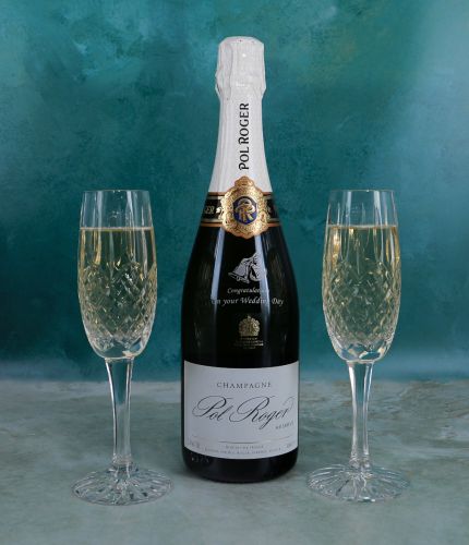 Pol Roger Champagne engraved gift set 2 consists of an engraved 75cl Bottle of Champagne and two fully cut crystal champagne flutes. It's beautifully presented in a lovely black foam lined box. Bottle Engraving is included.