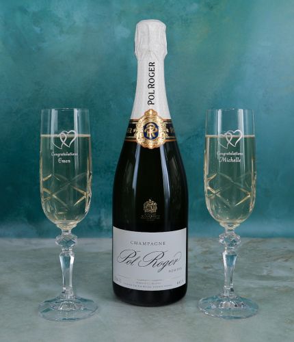 Pol Roger Champagne engraved gift set 3 consists of a standard 75cl Bottle of Champagne and two engraved crystal champagne flutes. It's beautifully presented in a lovely black foam lined box. Crystal Engraving is included.
