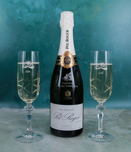 Pol Roger Champagne Gift Set 4 consists of an engraved bottle of champagne and two crystal champagne flutes. The Set is completed in a lovely black foam cut out presentation box. We supply you with engraving drafts for approval