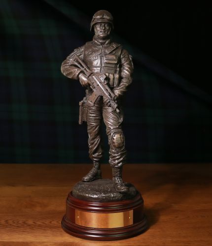 A Modern Armed British Police Officer with an issued G36 assault rifle. The sculpture is 12 Inches tall, we include the standard wooden base and an engraved brass plate as standard.