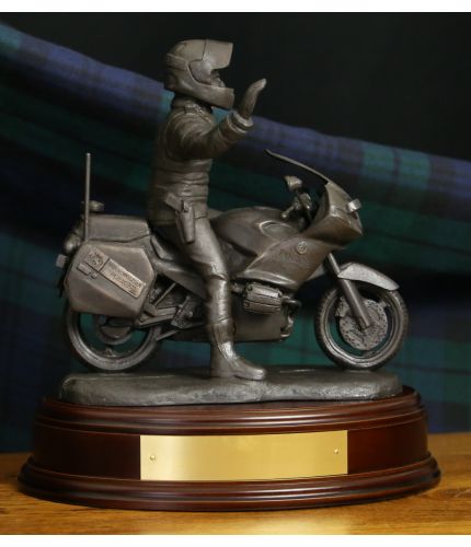 A Police Officer on his BMW Motorcycle is sculpted in an 8" scale and the figurine commemorates the officers serving in the Special Escort Group of the British Police. We include the standard wooden base and an engraved brass plate as standard.