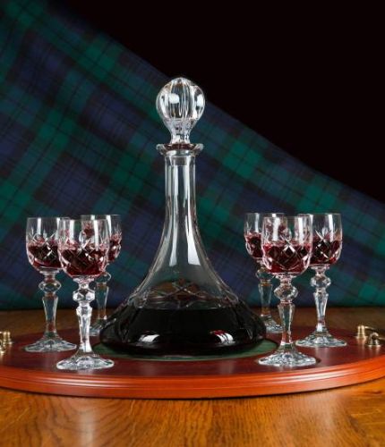 This is our Port, 7 Piece Tray Set which has a mixed cutting style. The Ships Port Decanter is engraved, however the port glasses are fully cut. We can also add an engraved brass plate to the wooden base if required.