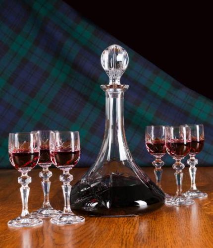 A  'Ships' Port Decanter and 6 Port Glasses hosting set complete in their own dark green, satin lined presentation boxes. This is a panel style which means engraving is possible and hand engraving on each front panel is included.