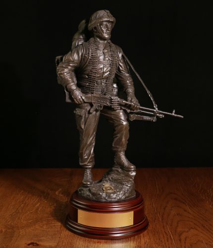 12" scale cold cast bronze resin sculpture of a Royal Air Force Regiment Mortarman. Wearing webbing and a bergan, he has his SA80 in on hand and is holding the 81mm mortar barrel in the other.  Brass engraved pate included.