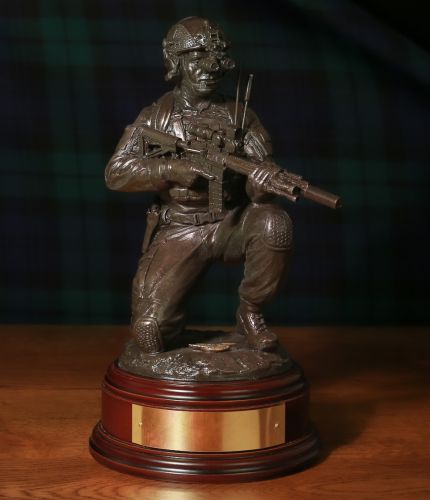 12" scale cold cast bronze resin sculpture of a Ranger Regiment soldier of the British Army with the new Knight Stoner 1 (KS1) assault rifle. We have a choice of wooden base and we also offer a free engraved brass plate.