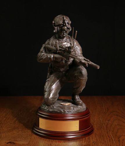 12" scale cold cast bronze resin sculpture of a Ranger Regiment soldier of the British Army with the new Knight Stoner 1 (KS1) assault rifle. We have a choice of wooden base and we also offer a free engraved brass plate.