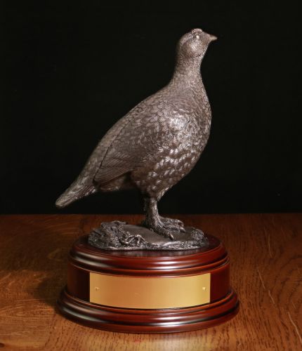 This is our sculpture of a Red Grouse sculpted at 19cm tall. We manufacture it ourselves here in Walkerburn. There's a choice of finishes and bases, we also include engraving if required.