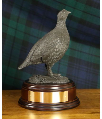 This is our sculpture of a Red Grouse sculpted at 19cm tall. We manufacture it ourselves here in Walkerburn. There's a choice of finishes and bases, we also include engraving if required.