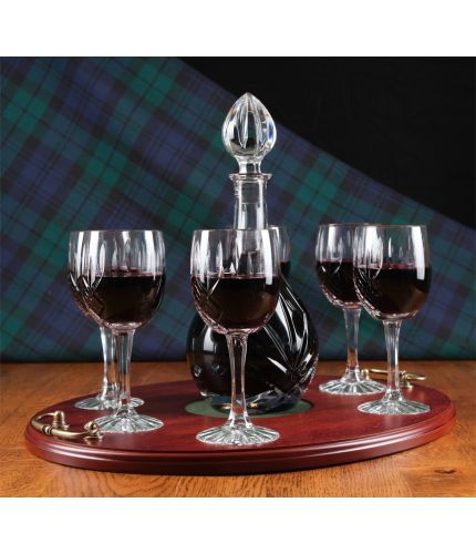A 7 piece, panel cut, wine tray set consisting of a decanter and six panel cut red wine goblets with a wooden serving tray. We offer free engraving in the front panels of each item and the set is completed inside a set of presentation boxes