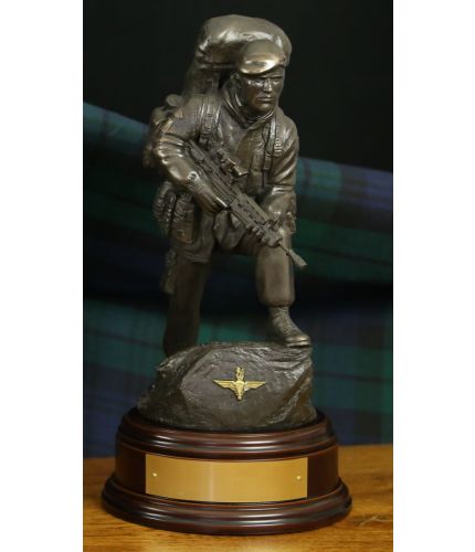 This is an 11" scale cold cast bronze resin sculpture of a Paratrooper in an alert pose. The sculpture makes a perfect retirement gift and we include this standard wooden base and an engraved brass plate as standard.