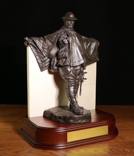 This is the Gunner Driver of the Great War. We include this wooden base and an engraved plate. You can select the badge of your choice which we mount on the back wall, We're showing RA, RHA and RLC. An engraved plate is also included.