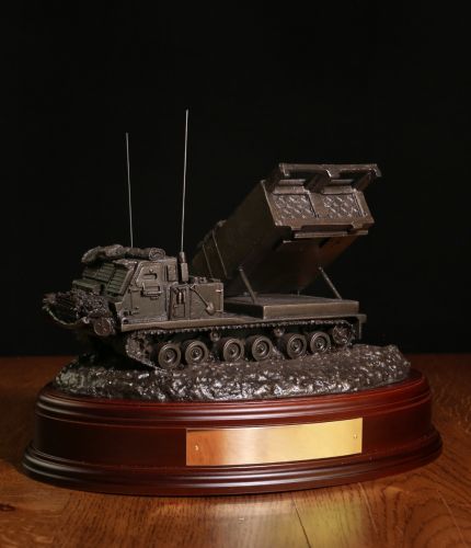 British Army Royal Artillery MLRS Vehicle, Bronze. The sculpture is mounted on a wooden base which is designed to take a cap badge and engraved plate. It makes an ideal military farewell gift or commemorative piece.