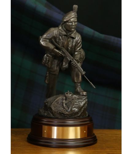 Royal Irish Ranger soldier in an alert pose wearing a caubeen. Handmade in a bronze finish, he is sculpted to an 11" scale.