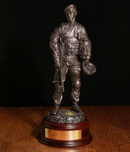 A commemorative sculpture depicting a Royal Marines Commando having a Patrol Debrief finished in cold cast bronze. Hand made by us here in the UK we also offer the engraved brass plate free of charge.