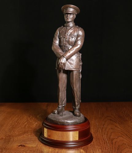 Royal Military Academy Sandhurst Male Cadet in a 12" scale . We complete the sculpture with a choice of badge, finish and wooden base and a fully engraved nameplate on the front of the base. Please note, the silver version is hallmarked.