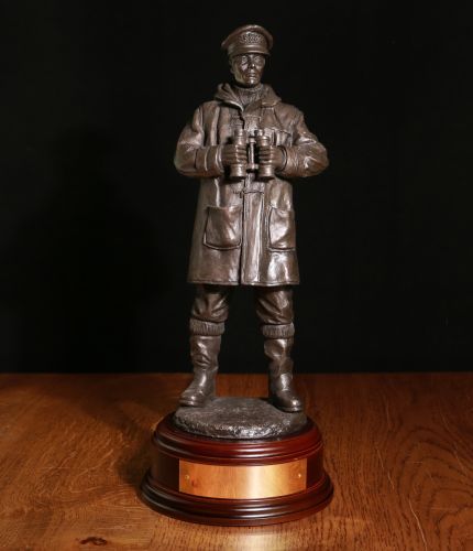 12" Scale sculpture of a Royal Navy Officer On Watch. We are able to offer it in Cold Cast Bronze, Painted, Traditional Hot Cast Bronze and Silver. We also offer various wooden base options and an engraving plate if required.