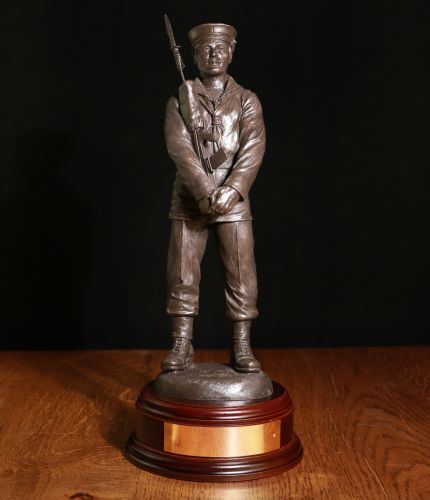 12" Scale sculpture of a modern Royal Navy Rating in Parade Dress. He's in a 'Stand Easy' pose which is a lovely way of displaying the Sculpture. We include this wooden base as standard, and a free brass engraving plate.