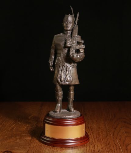 8" Scale Statue of a Private Soldier of the Royal Regiment of Scotland in Parade Dress with SA80 Rifle. We offer a choice of Wooden bases and a free engraving plate.