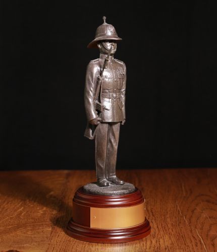 8" Scale sculpture of a SLR Era Royal Marine in full parade dress with distinctive pith helmet. We offer a choice of finishes and wooden bases. We also offer a free engraved brass plate as standard.