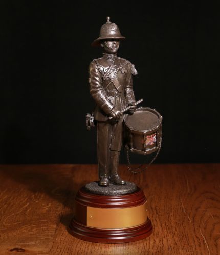 8" Scale sculpture a Royal Marine Drummer in full parade dress with distinctive pith helmet. We offer a choice of finishes and wooden bases. We also offer a free engraved brass plate as standard.