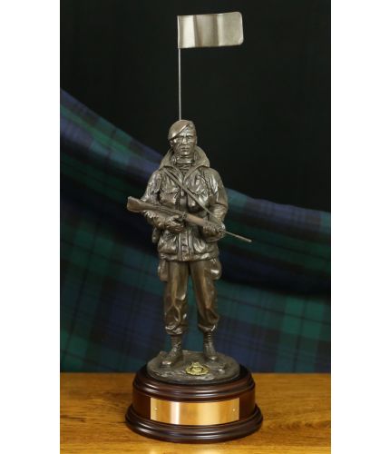 A 12" tall sculpture of Royal Marines Commando during the impressive Falklands War Yomp. Its a replica of the large commemorative bronze standing in Portsmouth. We include the wooden base and engraved brass plate.