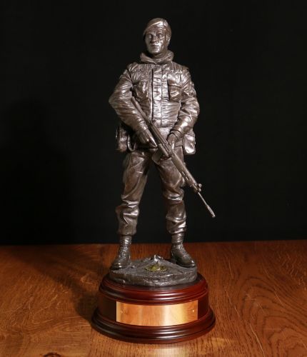 A sculpture depicting a Royal Marines Commando during the Ulster Troubles. He's on Urban Foot Patrol. A bronze commemorative presentation gift for the veteran marine. The engraved plate on the base is included.