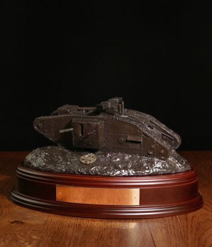 British Army World War One Tank, Bronze. The sculpture is mounted on a wooden base which is designed to take a cap badge and engraved plate. It makes an ideal military farewell gift or commemorative piece.