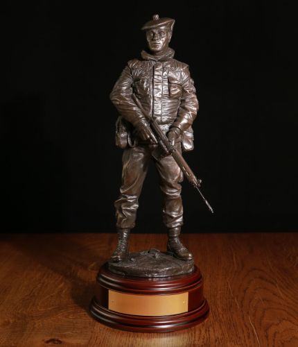 A sculpture of a Scottish Infantry soldier on Urban Patrol in Northern Ireland during the Troubles. We can add a cap badge and a choice of wooden base. We also include an optional engraved brass plate