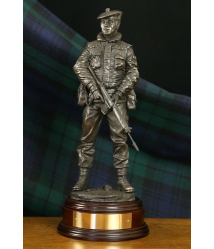 A sculpture of a Scottish Infantry soldier on Urban Patrol in Northern Ireland during the Troubles. We can add a cap badge and include this base as standard. We also include an optional engraved brass plate