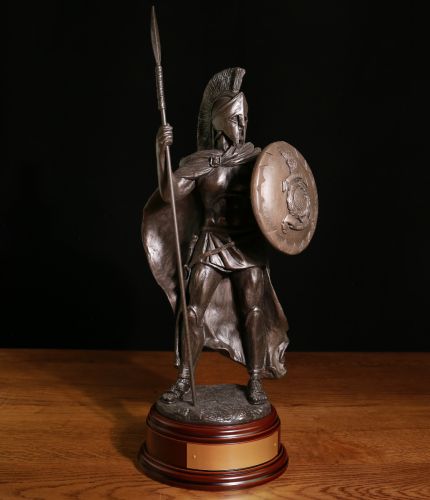 This is our 12" tall Royal Marines 'Spartan Warrior' with a Royal Marines Globe and Laurel Crest on his shield. We include a brass engraved plate on the wooden base.