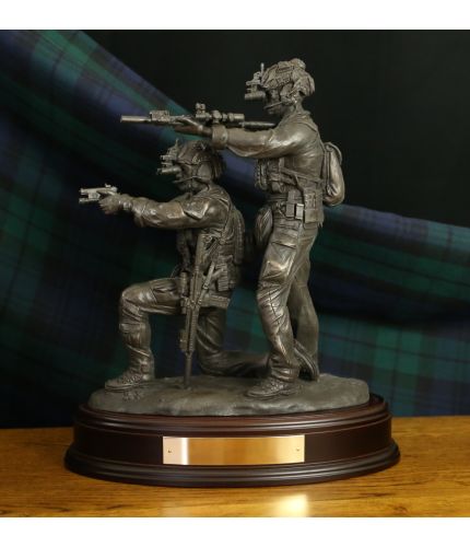 Special Forces ' Immediate Action', a trooper has dropped to his knee after a stoppage and his buddy provides covering fire. The sculpture is in the 12" scale and we offer a choice of finishes and wooden bases. Brass engraving plates are included. 