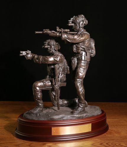 Special Forces ' Immediate Action', a trooper has dropped to his knee after a stoppage and his buddy provides covering fire. The sculpture is in the 12" scale and we offer a choice of finishes and wooden bases. Brass engraving plates are included.