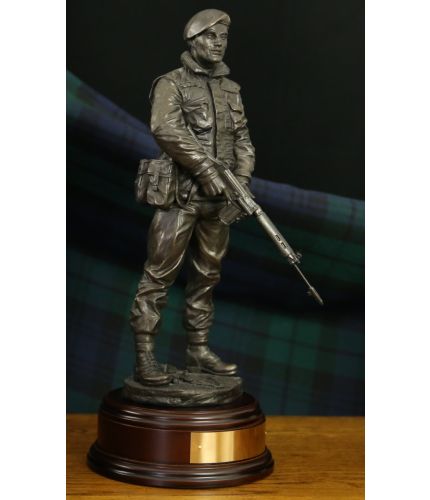 This 12" sculpture is of a Ulster Defence Regiment (UDR) soldier on a foot patrol in an urban part of Ulster. We include this wooden base as standard and offer an engraving plate free of charge.