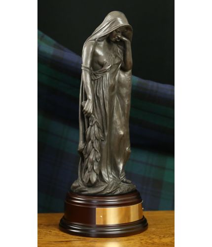 This is a faithful replica of the 'Mother of Canada' memorial that is a feature from the Canadian Vimy Ridge World War 1 Memorial. This is the Cold Cast Bronze version and she stands 12" tall on this wooden base and we offer a free engraved base plate.