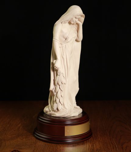 This is a faithful replica of the 'Mother of Canada' memorial that is a feature from the Canadian Vimy Ridge World War 1 Memorial. This is the Ivory finish version and she stands 12" tall on this wooden base and we offer a free engraved base plate.