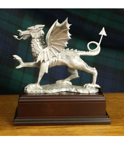 Classic Welsh Dragon cast in buffed pewter and engraved with a personal message making a lovely gift idea, a retirement award, long service presentation or gift. Wooden base of choice and engraved plate included