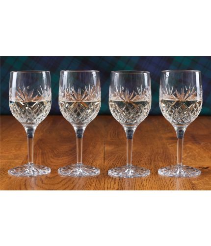 A boxed set of four crystal white wine glasses. (Fully cut glasses cannot be engraved).