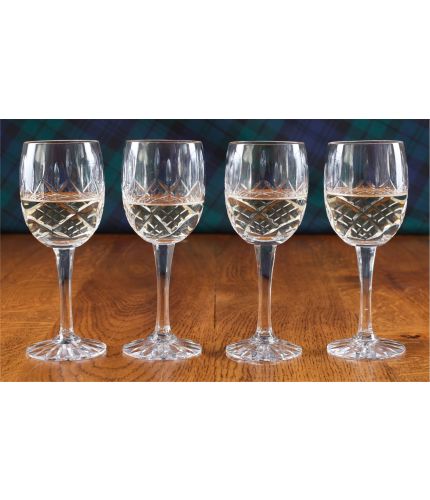 A boxed set of four panel cut white wine glasses. We offer free engraving in the front panels of each item and the set is completed inside a dark blue satin lined presentation box.