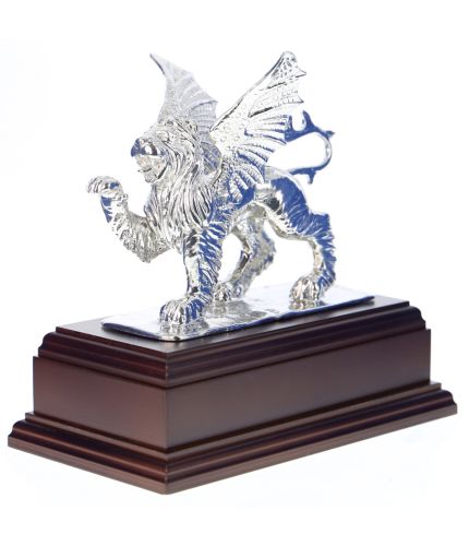 A handmade statue of a winged lion with a front paw raised. Cast in polished pewter this statue is the symbol of 37 (V) Signals Regiment and is used as a presentation piece for retirements and soldiers leaving the Unit. Every statue comes mounted on a woo