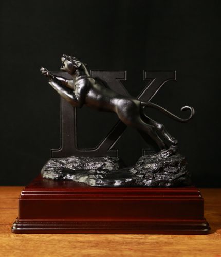 We've made this leaping 9 Regiment RLC Black Panther in lead free Pewter. We offer it plain on the base, or badged with an RLC Crest for 9 Regiment, Royal Logistic Corps. We include  an engraved silver finished plate.