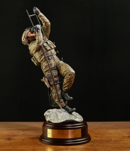A military statuette of a Special Forces Navy Marine undertaking a ladder climb out of the sea during a ship assault. We include the standard wooden base and an engraved brass plate( if required) as part of any order.